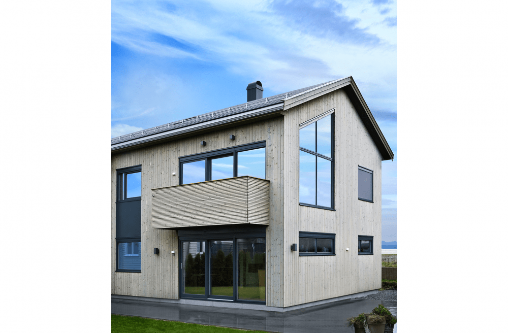 Bygning bygget i grå Superwood brædder.